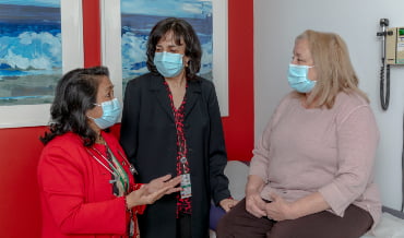 Drs. Volgman and Aggarwal with a patient