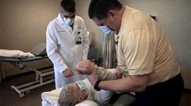 Dr. Saleem and Dave Maaske with patient