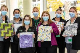Nurses with quilts