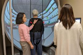 Patricia Worley works with Rush rehab therapists in the Bertec machine