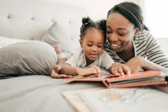 Mom & daughter on bed