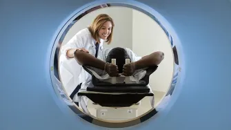 CT scan machine with patient and care provider