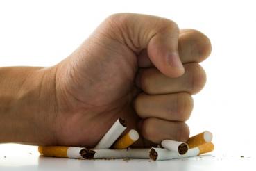 Hand smashing cigarettes