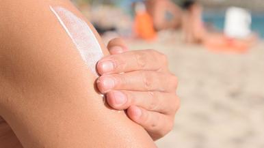 Man applying sunscreen