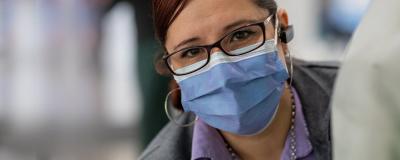 Rush employee wearing a mask