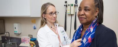 Dr. Nancy Reau with a patient